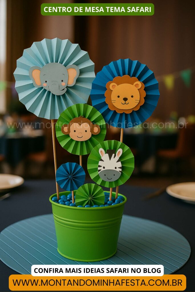 Centro de mesa safari com rosetas de papel colorido e animais como elefante, leão, zebra e macaco em balde verde decorado.